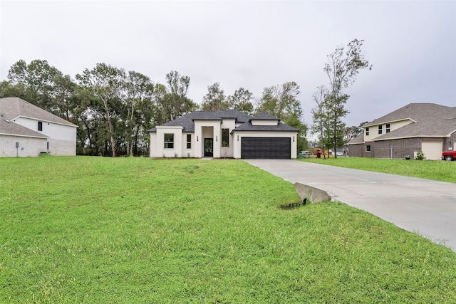 view of front of house with a garage and a front lawn