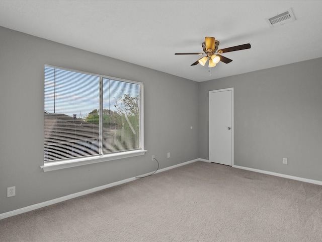 carpeted empty room with ceiling fan