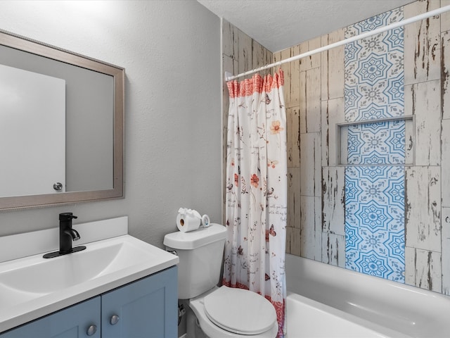 full bathroom with vanity, shower / tub combo, a textured ceiling, and toilet