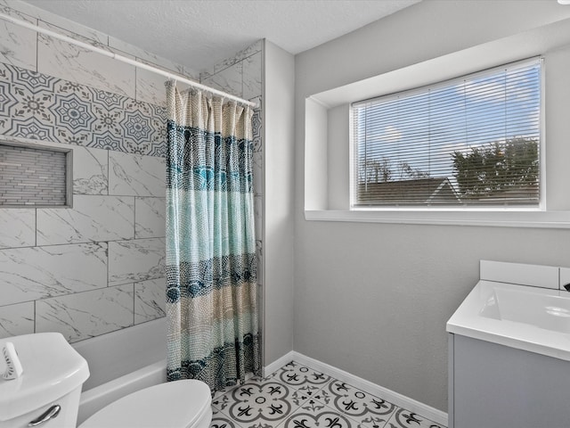 full bathroom featuring shower / bath combination with curtain, tile patterned floors, vanity, a textured ceiling, and toilet