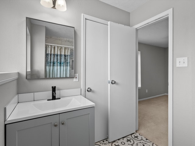 bathroom with vanity and a textured ceiling