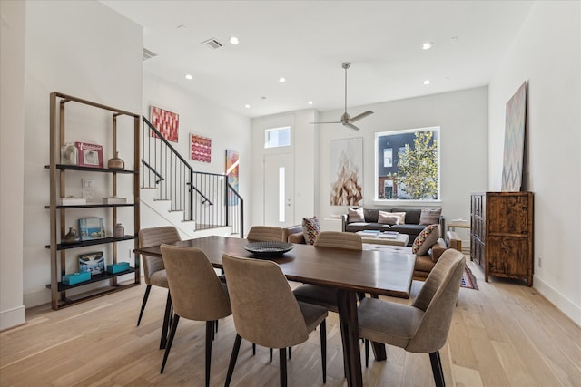 dining space featuring light hardwood / wood-style floors and ceiling fan