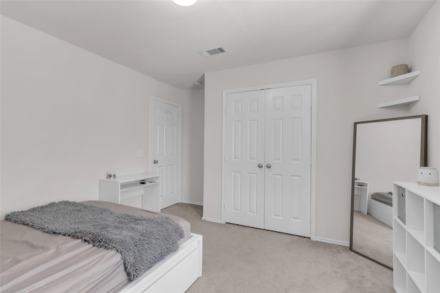 carpeted bedroom featuring a closet