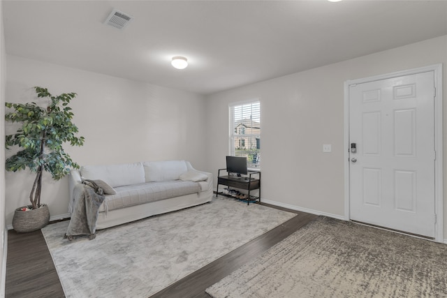 living room featuring dark hardwood / wood-style flooring