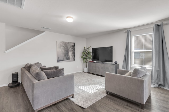 living room with dark hardwood / wood-style floors