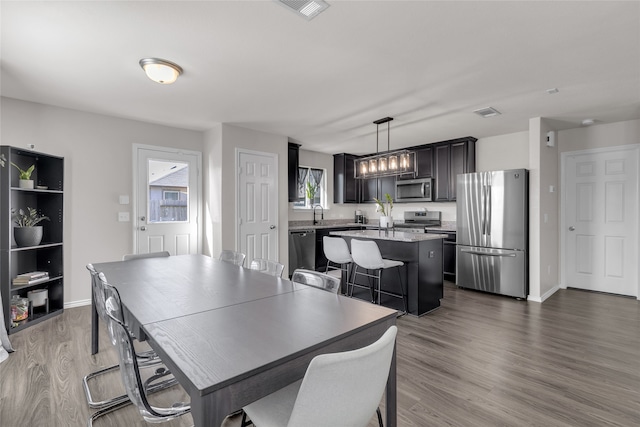 dining space featuring hardwood / wood-style floors