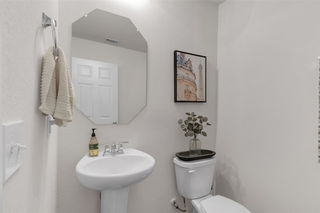 bathroom with sink and toilet