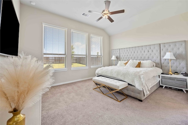 bedroom featuring ceiling fan, carpet floors, and vaulted ceiling