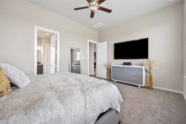 bedroom with ceiling fan, carpet floors, and connected bathroom