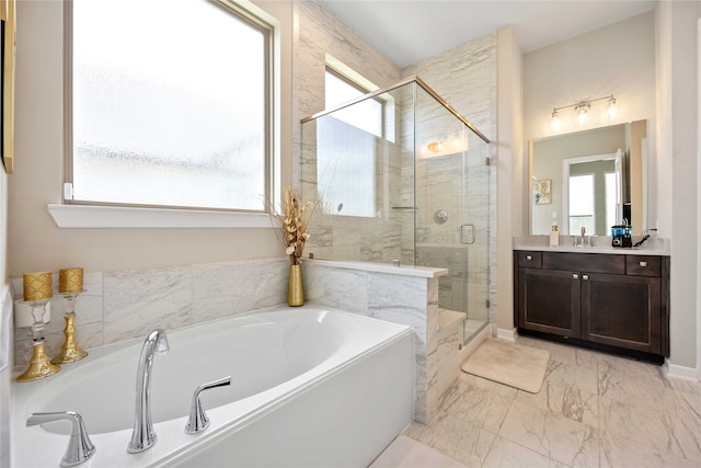 bathroom featuring vanity and independent shower and bath