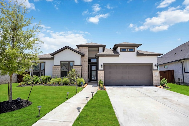 prairie-style house with a front lawn and a garage