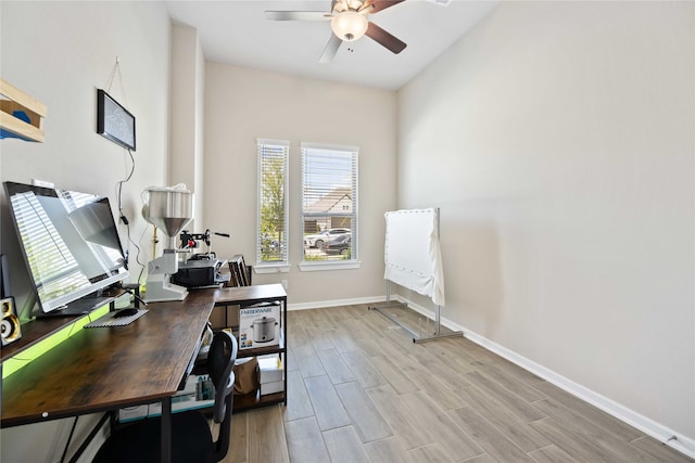 office area with ceiling fan and light hardwood / wood-style flooring