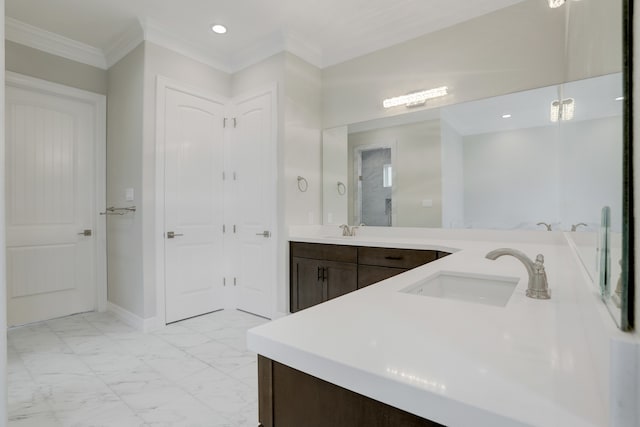 bathroom with crown molding and vanity