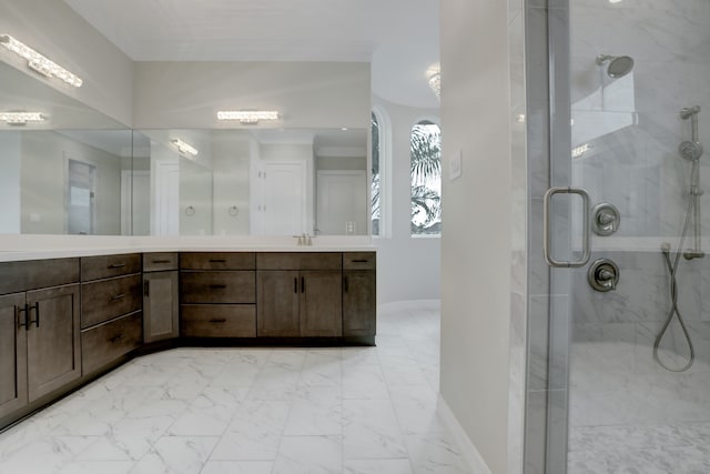 bathroom featuring vanity and an enclosed shower