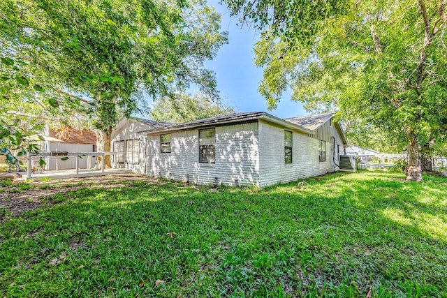 1215 Esther St, Kemah, TX 77565 - view of side of property featuring central AC