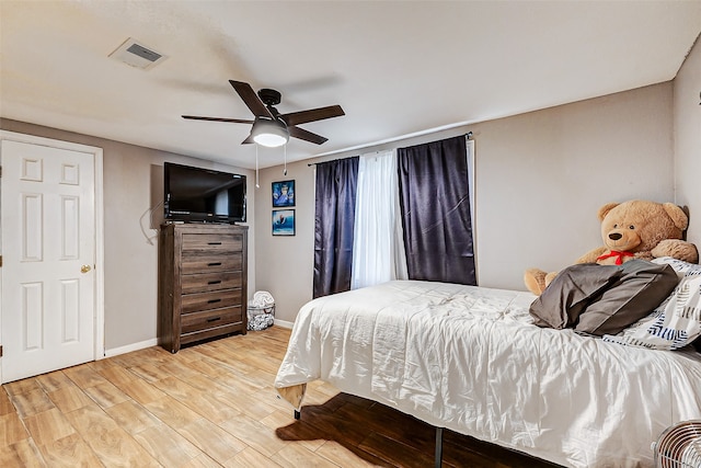 bedroom featuring ceiling fan and light hardwood / wood-style flooring