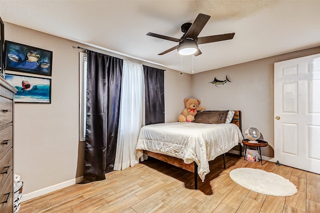 bedroom featuring ceiling fan and light hardwood / wood-style floors