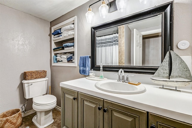 1215 Esther St, Kemah, TX 77565 - bathroom with vanity, toilet, tile patterned floors, and a shower with shower curtain