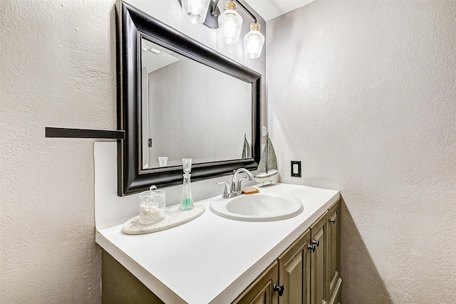 1215 Esther St, Kemah, TX 77565 - bathroom with a textured wall and vanity