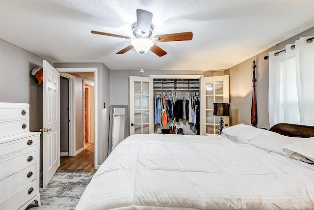 1215 Esther St, Kemah, TX 77565 - bedroom with wood finished floors, a closet, ceiling fan, and baseboards