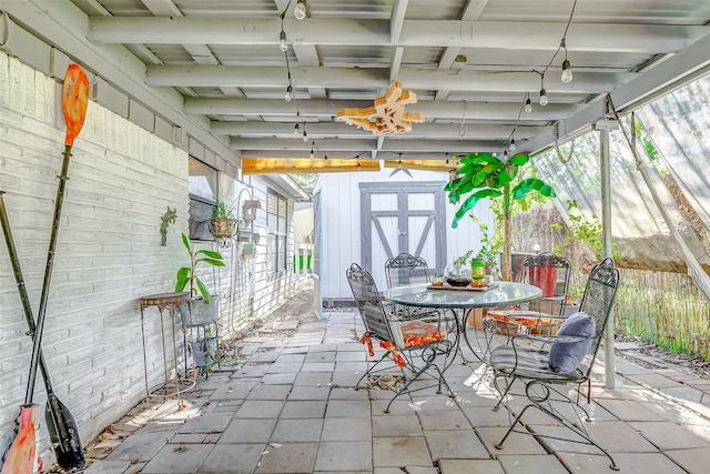 view of patio featuring a storage unit