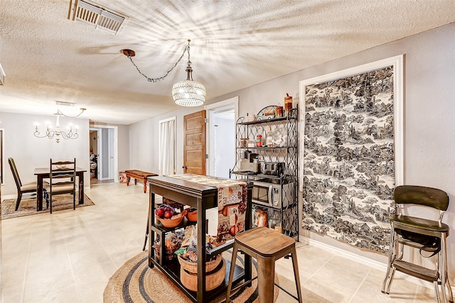 dining space featuring a textured ceiling and an inviting chandelier