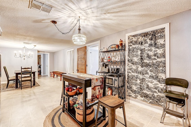 1215 Esther St, Kemah, TX 77565 - dining room featuring a chandelier, a textured ceiling, baseboards, and light tile patterned floors