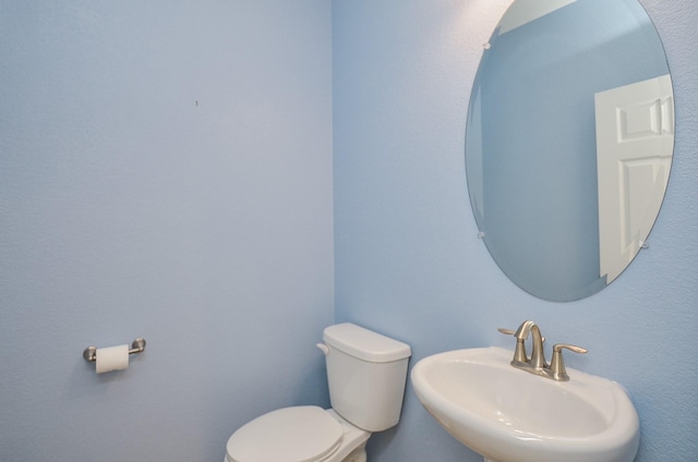 bathroom with sink and toilet