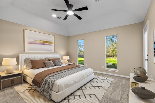 carpeted bedroom featuring ceiling fan and vaulted ceiling