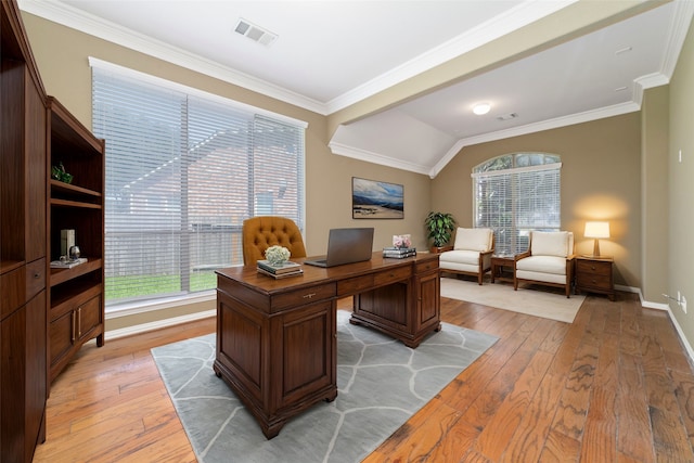 office featuring lofted ceiling, light wood-type flooring, and ornamental molding