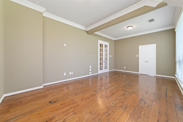 spare room featuring wood-type flooring, french doors, and crown molding