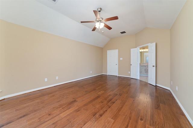 unfurnished room featuring hardwood / wood-style floors, vaulted ceiling, and ceiling fan