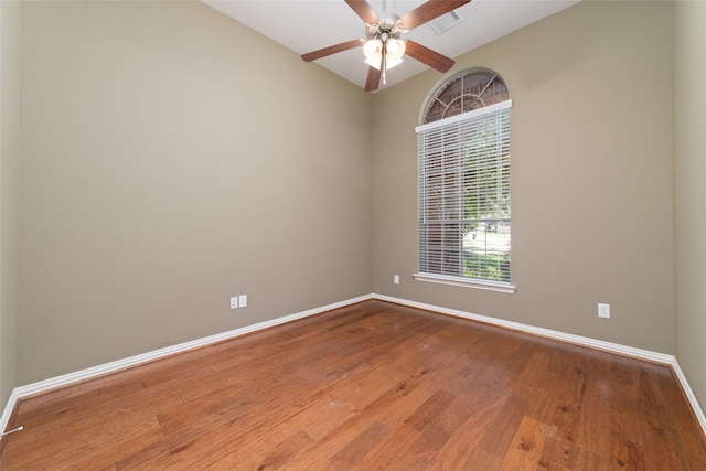 spare room featuring ceiling fan, hardwood / wood-style floors, and lofted ceiling