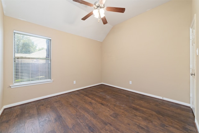 spare room with vaulted ceiling, ceiling fan, and dark wood-type flooring