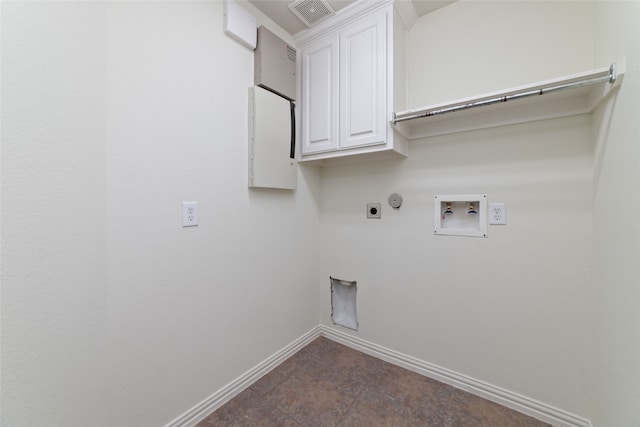 laundry room featuring hookup for an electric dryer, hookup for a gas dryer, cabinets, and hookup for a washing machine