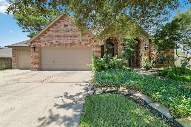 tudor-style house featuring a garage