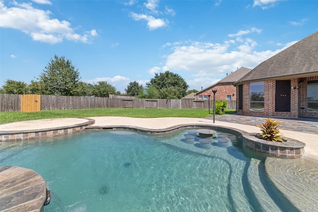 view of swimming pool featuring a patio