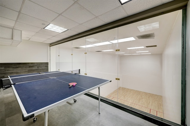 rec room featuring a paneled ceiling