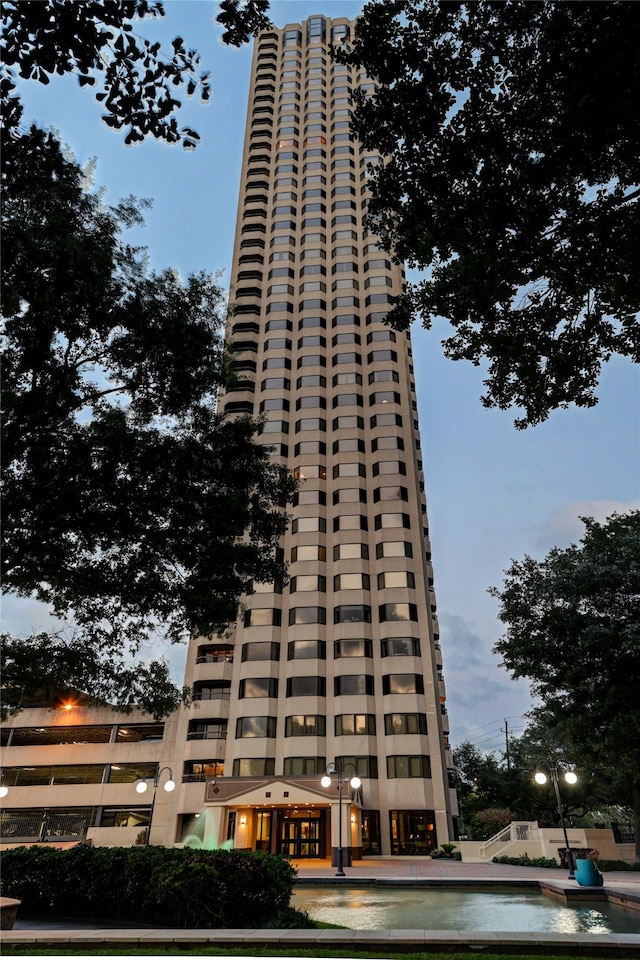 view of outdoor building at dusk