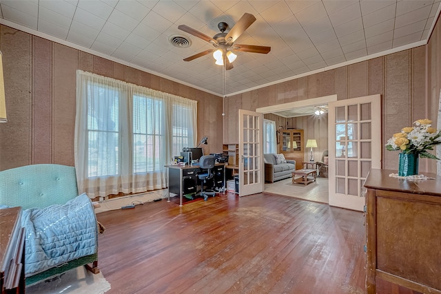 home office with french doors, hardwood / wood-style flooring, and ceiling fan