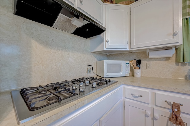 kitchen featuring white cabinets and stainless steel gas cooktop