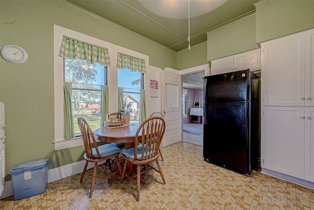 dining area featuring ornamental molding