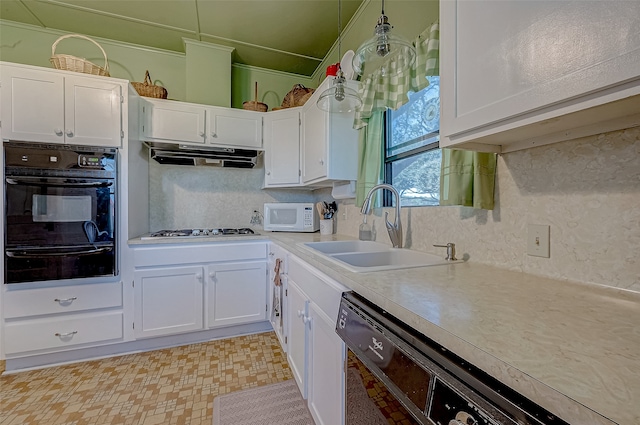 kitchen featuring white cabinets, sink, crown molding, and black appliances