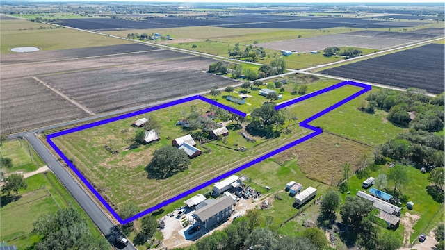 birds eye view of property with a rural view