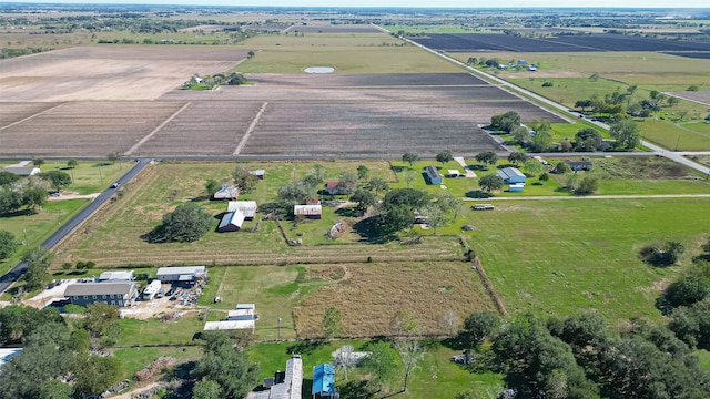 birds eye view of property with a rural view