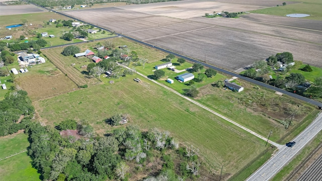 birds eye view of property with a rural view