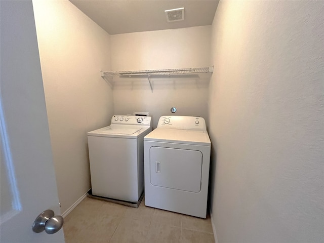 laundry room featuring washing machine and clothes dryer