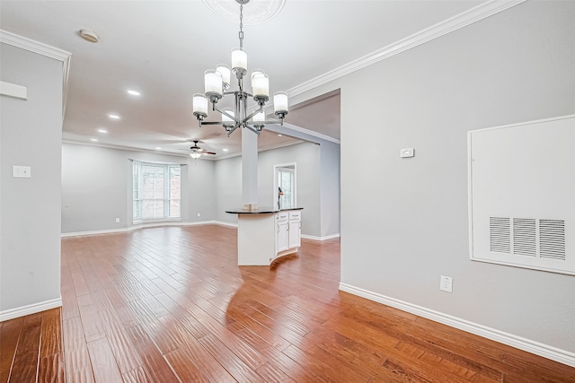 empty room with light wood-type flooring, ceiling fan with notable chandelier, and ornamental molding