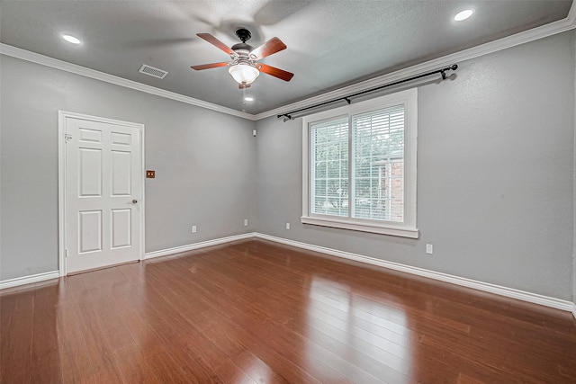 spare room with ceiling fan, wood-type flooring, and crown molding