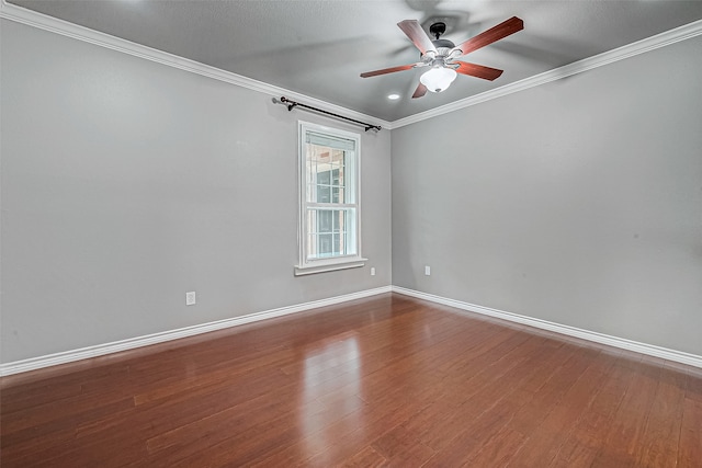 spare room with ceiling fan, hardwood / wood-style floors, and crown molding